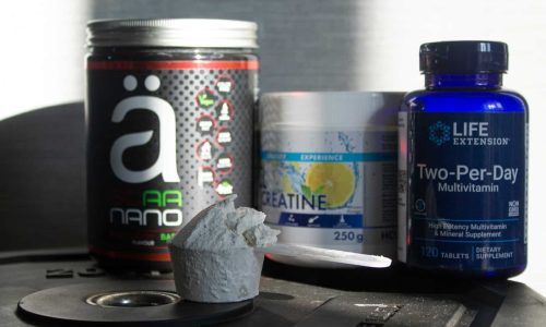 a table topped with bottles of vitamins and pills