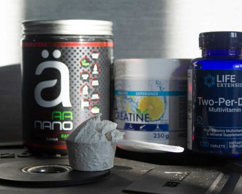 a table topped with bottles of vitamins and pills