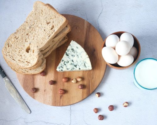 sliced bread on brown wooden chopping board